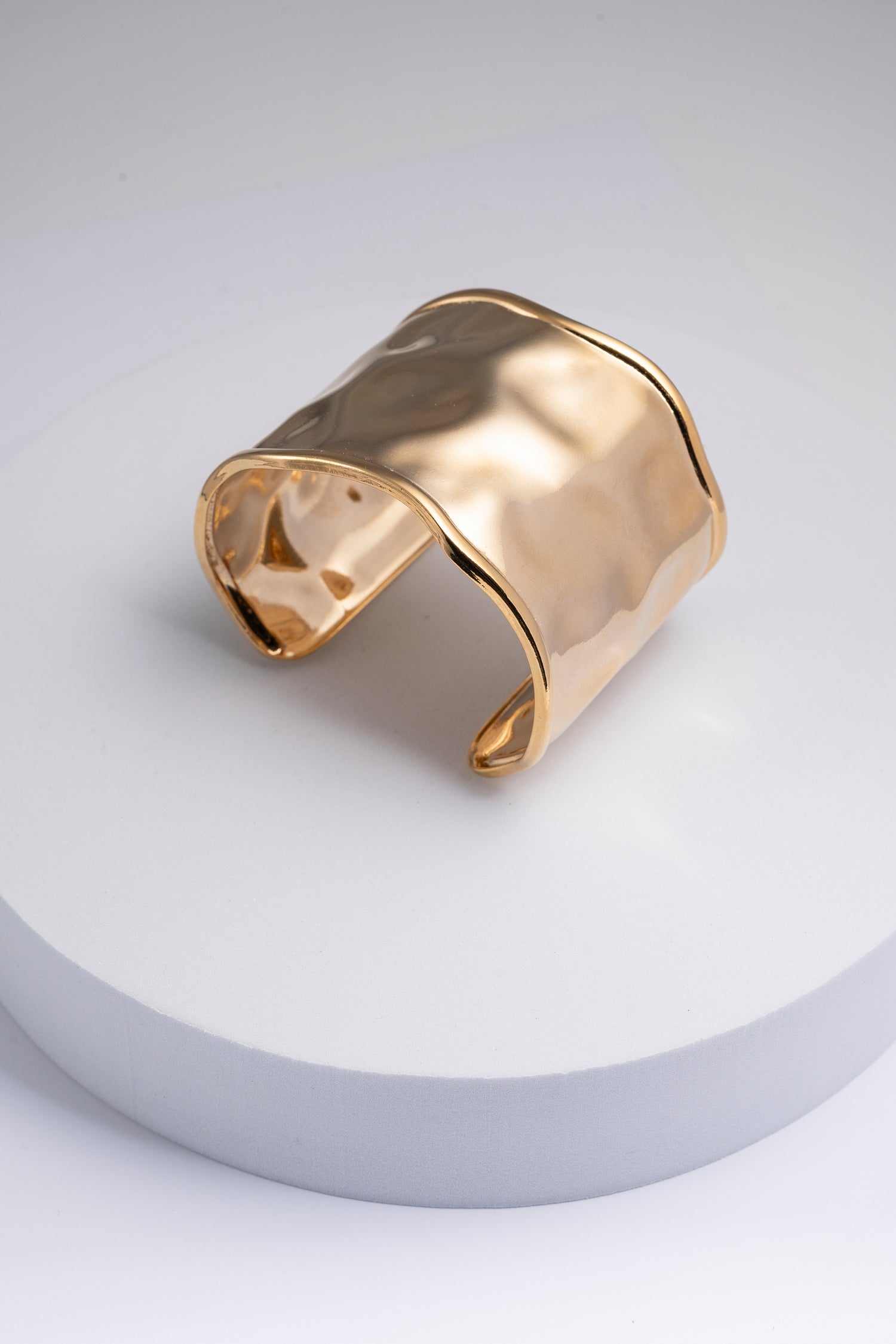 Bracciale dorato rigido regolabile effetto onda Thalassa