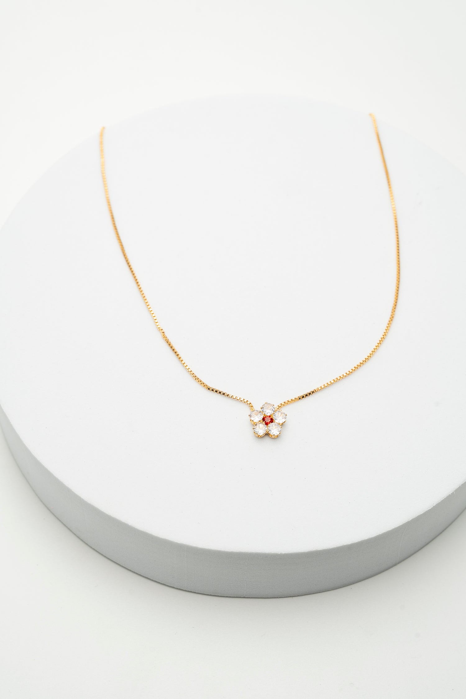 Collana Fiore Dorato con Zirconi e Punto Luce Rosso Red Bloom